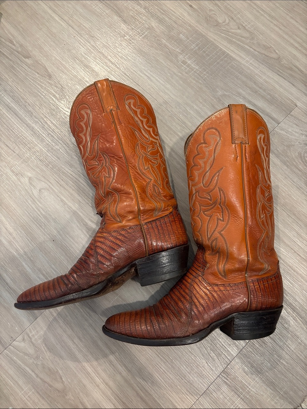 Justin’s lizard burnt orange cowboy boots